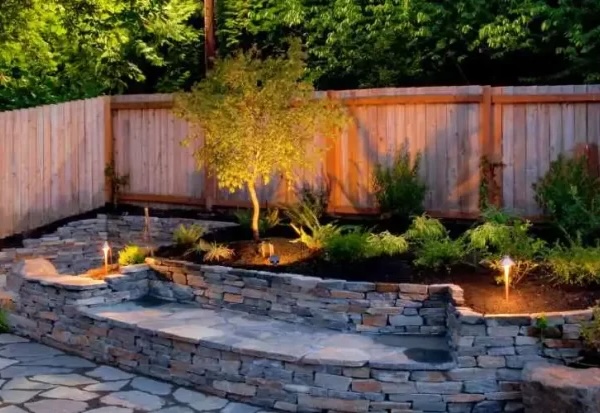 landscape lighting project completed around a garden bed in Grants Pass